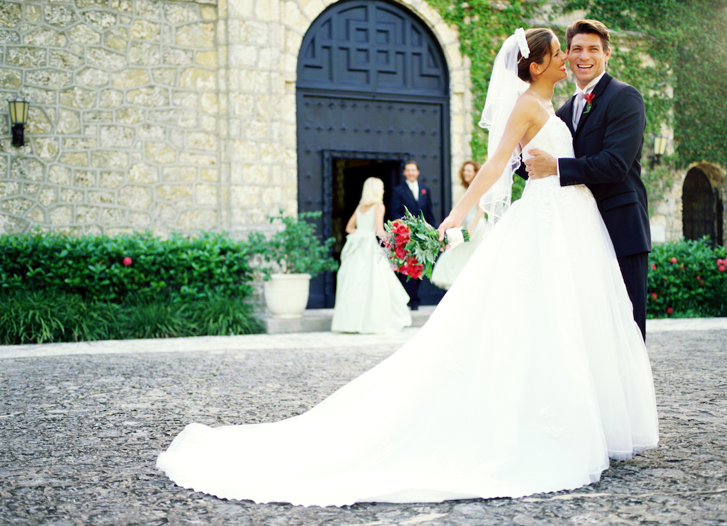 Portrait Of The Bride And Groom Standing Outside A Church Loans 2 Go 5618