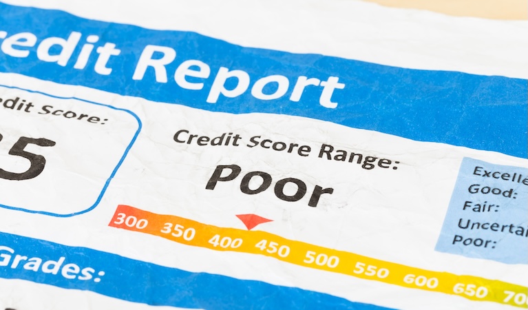 Poor credit report on wrinkled paper